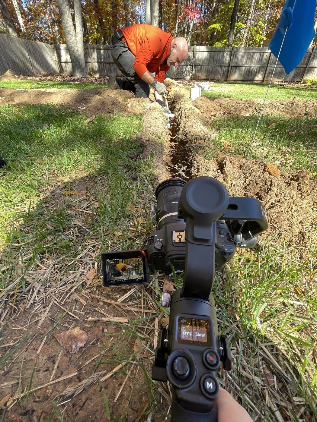 Filming the crew trenching a new irrigation line